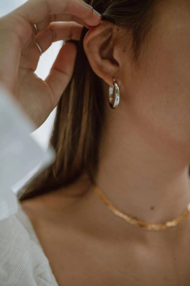 5 Secrets Behind Premium 14k Gold Body Jewelry Production-1 a woman is wearing a body jewelry.